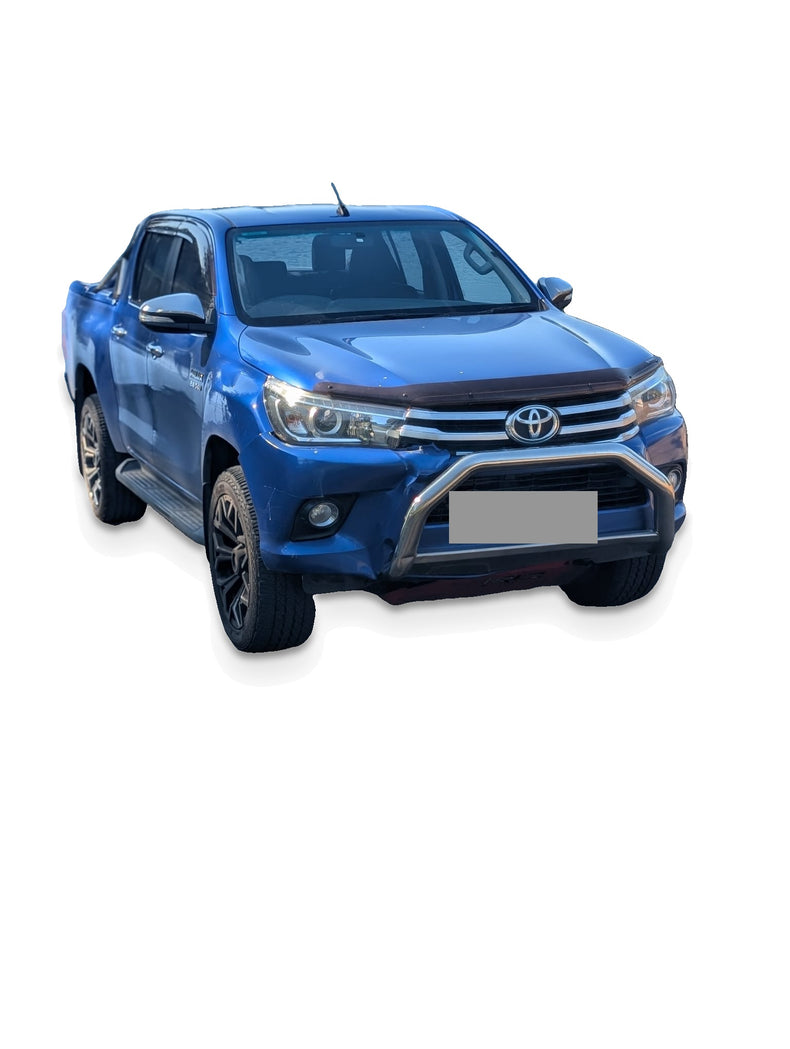 Before upgrade - white studio photo of the same Hilux; additional accessories shown; refer to pack inclusions